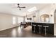 Open dining area featuring dark wood floors, a breakfast bar, and plenty of natural lighting at 5132 E Grandview Rd, Scottsdale, AZ 85254