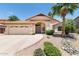 Charming single-story home with a well-manicured front yard, desert landscaping, and an attached two-car garage at 5132 E Grandview Rd, Scottsdale, AZ 85254