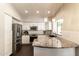 Bright kitchen with stainless steel appliances, white cabinetry, and granite countertops at 5132 E Grandview Rd, Scottsdale, AZ 85254