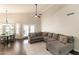 Bright living space features vaulted ceilings, a grey sectional sofa, and an adjacent dining area with a round table at 5132 E Grandview Rd, Scottsdale, AZ 85254