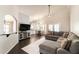 Open concept living space with a spacious sectional sofa, adjacent dining area, and a kitchen view at 5132 E Grandview Rd, Scottsdale, AZ 85254