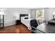 Comfortable bedroom with wood floors, a desk, and a view from the window at 540 N May -- # 3117, Mesa, AZ 85201
