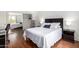 Bright bedroom with wood floors, mirrored closet, and a neatly made bed at 540 N May -- # 3117, Mesa, AZ 85201