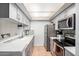 Bright kitchen featuring stainless steel appliances, ample counter space, and stylish cabinetry at 540 N May -- # 3117, Mesa, AZ 85201