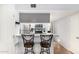 Modern kitchen with breakfast bar, stainless steel appliances, and stylish backsplash at 540 N May -- # 3117, Mesa, AZ 85201