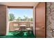 Relaxing patio with chairs and table overlooking a vibrant outdoor space at 540 N May -- # 3117, Mesa, AZ 85201