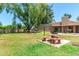Community picnic area with park benches and mature trees on a bright day at 540 N May -- # 3117, Mesa, AZ 85201