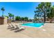 Community pool with lounge chairs surrounded by desert landscaping at 540 N May -- # 3117, Mesa, AZ 85201