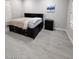 Bright bedroom boasts light floors, a storage bed, and ample space, creating a cozy retreat at 5490 W Trenton Way, Florence, AZ 85132