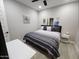 Cozy bedroom featuring light floors and a TV, offering a relaxing space at 5490 W Trenton Way, Florence, AZ 85132