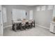 Bright dining room featuring shuttered windows and a table with seating for six at 5490 W Trenton Way, Florence, AZ 85132