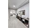 Open living area with light-colored wood floors and built-in shelving at 5490 W Trenton Way, Florence, AZ 85132