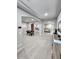 Open-concept living area featuring arches and views into multiple rooms at 5490 W Trenton Way, Florence, AZ 85132