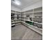 Spacious pantry with floor-to-ceiling shelving providing ample storage for food items and kitchen essentials at 5490 W Trenton Way, Florence, AZ 85132