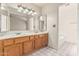 Bathroom with double sinks, vanity, and ample lighting, perfect for a comfortable morning routine at 6032 W Grovers Ave, Glendale, AZ 85308