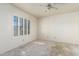 Bedroom with natural light, awaiting new flooring and decorative touches at 6032 W Grovers Ave, Glendale, AZ 85308