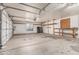Spacious garage interior with storage and work area potential, ample room for vehicles at 6032 W Grovers Ave, Glendale, AZ 85308