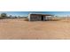 Expansive horse property with shelter and fenced area ready for equestrian use at 6032 W Grovers Ave, Glendale, AZ 85308