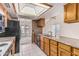 Traditional kitchen featuring wood cabinets, granite countertops, and appliances, perfect for cooking and entertaining at 6032 W Grovers Ave, Glendale, AZ 85308