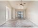 Spacious living room with a ceiling fan and sliding glass doors leading to the backyard pool at 6032 W Grovers Ave, Glendale, AZ 85308