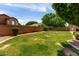 Spacious, green backyard enclosed by block wall for privacy at 7231 W Lone Cactus Dr, Glendale, AZ 85308