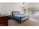 Spacious bedroom features vaulted ceilings, large windows, and neutral color palette at 7231 W Lone Cactus Dr, Glendale, AZ 85308