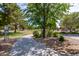 A serene community park with lush greenery, walking paths, and shade trees at 7231 W Lone Cactus Dr, Glendale, AZ 85308