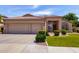 Charming home featuring a well-manicured lawn and a spacious three-car garage, perfect for suburban living at 7231 W Lone Cactus Dr, Glendale, AZ 85308