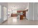 Bright kitchen boasts an island with bar seating and stainless steel appliances at 7231 W Lone Cactus Dr, Glendale, AZ 85308