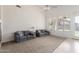 Spacious living room featuring two sofas, large window, and neutral color palette at 7231 W Lone Cactus Dr, Glendale, AZ 85308