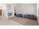 Bright living room with sofas, built-in shelving, and two-story vaulted ceilings at 7231 W Lone Cactus Dr, Glendale, AZ 85308