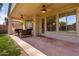 Covered patio with ceiling fans and outdoor seating, offering a relaxing space at 7231 W Lone Cactus Dr, Glendale, AZ 85308