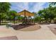 Fun-filled community playground with a covered play structure and a safe, sandy play area at 7231 W Lone Cactus Dr, Glendale, AZ 85308