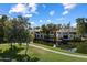 Scenic aerial view of waterfront homes along a picturesque lake at 7272 E Gainey Ranch Rd # 29, Scottsdale, AZ 85258