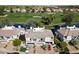 Aerial view of property with lush landscaping and a golf course view at 7272 E Gainey Ranch Rd # 29, Scottsdale, AZ 85258