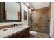 Bathroom featuring a large vanity, glass-enclosed shower, and tile flooring at 7272 E Gainey Ranch Rd # 29, Scottsdale, AZ 85258