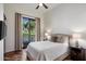 Bedroom featuring a window overlooking a golf course and a ceiling fan for added comfort at 7272 E Gainey Ranch Rd # 29, Scottsdale, AZ 85258