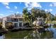 Beautiful view of the home's exterior backing to a serene lake at 7272 E Gainey Ranch Rd # 29, Scottsdale, AZ 85258