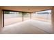 Spacious backyard featuring a covered patio, gravel, and a block wall for privacy at 7439 E Ed Rice Ave, Mesa, AZ 85208