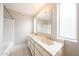 Bathroom featuring dual sinks with a large vanity, ample lighting, and a bathtub at 7439 E Ed Rice Ave, Mesa, AZ 85208