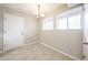 A simple dining room with tile floors, a chandelier, and natural light at 7439 E Ed Rice Ave, Mesa, AZ 85208