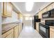 Functional kitchen with ample counter space, and black appliances for easy meal preparation at 7439 E Ed Rice Ave, Mesa, AZ 85208