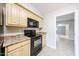 Practical kitchen area, showcasing ample cabinet space, and black appliances ready for everyday cooking needs at 7439 E Ed Rice Ave, Mesa, AZ 85208