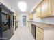 Spacious kitchen features a full appliance package and light-colored cabinetry at 7439 E Ed Rice Ave, Mesa, AZ 85208