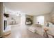 Open-concept space with tile flooring, a decorative fireplace, and a view into the dining area at 7439 E Ed Rice Ave, Mesa, AZ 85208