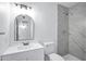 Updated bathroom with tile surround walk-in shower, modern vanity, and soft, neutral finishes at 8002 E Whitton Ave, Scottsdale, AZ 85251