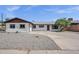 Charming single-story home with a well-maintained front yard and a classic desert landscape at 8002 E Whitton Ave, Scottsdale, AZ 85251