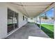Covered patio with view of the backyard, pool, and greenery at 8002 E Whitton Ave, Scottsdale, AZ 85251
