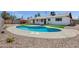 Beautiful backyard featuring a sparkling in-ground pool and landscaped yard, perfect for outdoor entertaining at 8002 E Whitton Ave, Scottsdale, AZ 85251