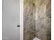 Shower featuring tile surround and shower head at 8002 E Whitton Ave, Scottsdale, AZ 85251